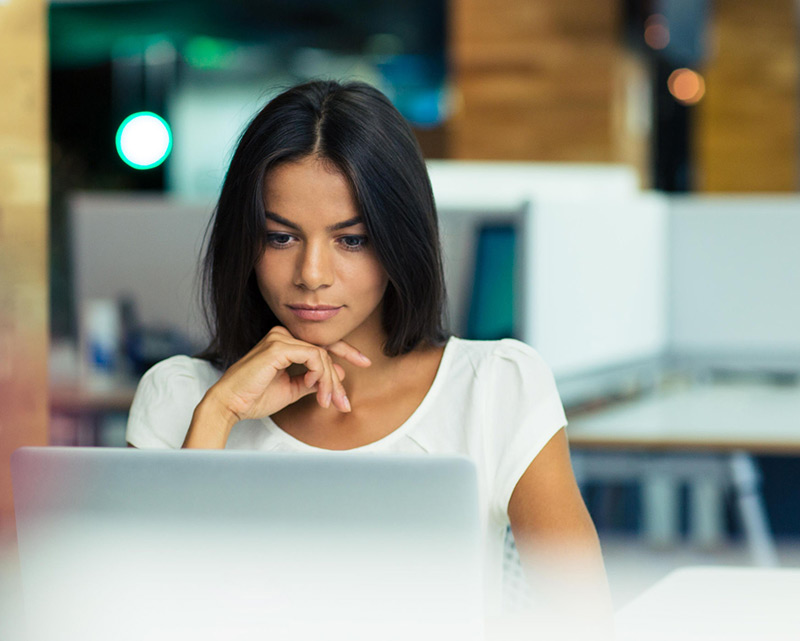 Woman looking at a computer screen. 